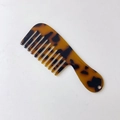 Detail view of the mini tortoiseshell hair comb with wide teeth and a convenient hang hole - 12# Leopard Print