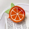 Cute orange slice shaped hair claw clip in bright orange and green acetate finish - Orange