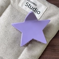 Vibrant purple star hair claw clip with glossy finish on a quilted soft background - Purple Claw Clip