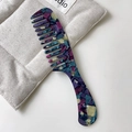 Handheld acetate hair comb with purple and teal marble texture and wide teeth - Textured Blue
