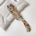 Tortoise shell cellulose acetate wide tooth comb with marble pattern and curved handle - Rainbow