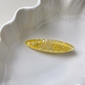 Elegant oval resin hair clip in translucent yellow with shimmering seashell fragments - Yellow