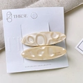 Set of two oval cream acetate hair clips with gold lettering on display card - One Pair / Milk White