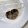 Detailed close-up of tortoise shell acetate heart comb with gold metal keychain hardware - 6# Leopard