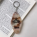Brown marble texture acrylic motel keychain with mountain design and outdoor life text - Brown