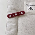 Vintage dark red hair clip with white flowers and rhinestones on beige canvas - Red