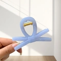 Close-up of lavender bow claw clip with gold spring detail in natural light - Small / Light Blue