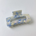 Detail of hollow rectangular claw clip with blue and purple marble texture finish - Rectangular Blue