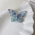 Schillernde Schmetterling-Haarklammer aus blau-violettem Acetat mit Marmoreffekt - Blaugrün