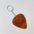 Detail view of amber marble texture acrylic guitar pick keychain with gold glitter flakes - Brown Yellow With Silver Buckle