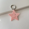 Pink acrylic star keychain with hollow smiley face and silver metal spring ring - Solid Light Pink