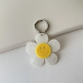Portachiavi girasole in acrilico bianco scintillante con viso sorridente giallo e gancio - Bianco