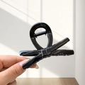 Glossy black ribbon twist design claw clip with high-shine finish and secure metal spring - Small / Bright Black