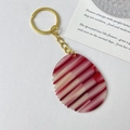 Chic acetate comb keychain featuring red and cream stripes with a gold-tone metal ring - Gold Ring - Textured Red