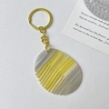 Mini comb keychain featuring yellow and grey marble pattern texture and golden metal ring - Gold Ring - Textured Yellow & Gray
