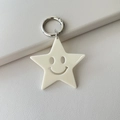 Creamy white acrylic star keychain with hollow smiley face and silver metal ring - Solid White