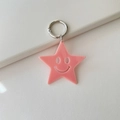 Pink acrylic star keychain with a hollow smiley face and silver metal spring ring - Solid Deep Pink