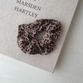 Elegant khaki leopard print scrunchie with soft fabric texture for women's hair styling - Dark Leopard Print Style