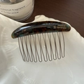 Close-up of handmade tortoise shell acetate hair comb with golden France lettering - Blue-Brown