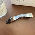Macro shot of grey marble pattern bow banana clip on a rustic wooden table background - 4# Ink Wash White