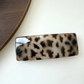 Detail of vintage leopard print acrylic hair clip showing polished surface and square shape - Wide Light Tortoiseshell