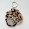 Macro shot of portable tortoiseshell acetate comb and mini mirror keychain set - 5.9cmx4.7cm / Light Tortoiseshell