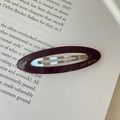 Deep purple acetate oval hair clip with gold lettering on an open book background - Dark Purple