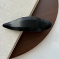 Macro detail of minimalist matte black swallowtail hair clip with geometric leaf design - Matte Black