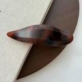 Detail of dark brown tortoiseshell hair clip in a sleek spindle design with acetate texture - Deep Matte Tortoiseshell
