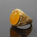 Golden ring with large oval yellow gemstone featuring vintage textured side patterns - Size 7 / Gold Tone Yellow Chalcedony Style