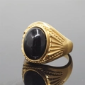 Vintage gold men's ring featuring a polished oval black onyx stone and engraved bands - Size 7 / Gold Tone Polished Black Stone Style