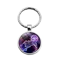 Detailed view of Scorpio zodiac sign glass dome keychain with purple starry sky pattern - Scorpio