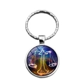 Silver Libra zodiac keychain with glowing scale motif and polished metal ring - Libra