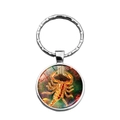 Porte-clés signe Scorpion avec scorpion doré et dôme en verre à motif nébuleuse - Scorpion