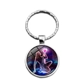 Aquarius zodiac sign keychain with a glass cabochon pendant and purple nebula star map - Aquarius