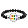 Close-up of black beaded bracelet featuring Love Wins rainbow text and silver metal charms - LOVE WINS Style (XSWX6381-21)