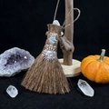 Detailed view of handmade Wicca altar broom with natural fibers, sun charm, and blue crystals - Silver Sun Style (10)