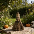 Detail of a handmade straw witch broom with hemp rope and dark heart charm on a stone - Smoky Quartz / 10cm