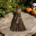 Close-up of handmade witch's broom with purple crystal on stone for Halloween decor - Amethyst / 10cm