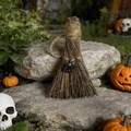 Detailed view of witch broom ornament with natural crystal stone on a stone surface - Obsidian / 10cm