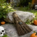 Close-up of handmade witch broom decor with natural stone on a textured grey rock - Blue Labradorite / 10cm