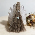 Close-up of witch besom broom with silver triquetra pendant and blue crystal raw stone - Besom with Celtic Knot and Amazonite / 20x13cm