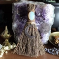 Macro detail of witch broom featuring a large opal crystal and silver crescent moon charm - Besom with Moon and Opal / 20x13cm