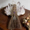 Detail of handmade witch broom with purple amethyst crystal and triquetra metal charm - Besom with Celtic Knot and Amethyst / 20x13cm