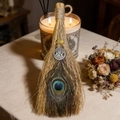 Detail of handcrafted witch broom with peacock feathers and Celtic moon pendant - 30*12cm / Peacock Feather Tree of Life Citrine