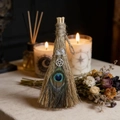 Detail of a handmade witch besom with peacock feather, crystal, and a pentagram charm - 15*6cm / Peacock Feather Star White Crystal