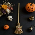 Mini witch broom decor with a golden skull pendant and natural straw textures - Golden Witch