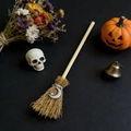 Detailed view of mini witch broom featuring natural straw and silver moon star pendant - Moon & Star