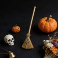 Detail of mini witch broom with silver sun pendant and natural bristles for Halloween decoration - Sunflower