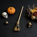 Miniature Halloween witch broom with small black witch charm on a dark mystic background - Witch Black